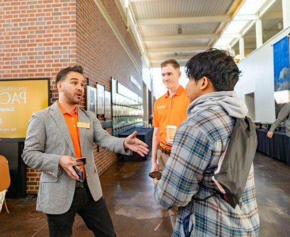 Representatives from the University of the Pacific Community Involvement Program speaks to a student